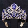 Detailed close-up of gold baroque crown with blue teardrop gems and sparkling crystals - KC Gold White + Royal Blue (Comb)