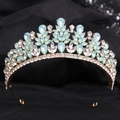 Macro detail of alloy bridal crown with light blue crystal teardrops and gold leaves - KC Gold White & Green Jelly Rhinestone
