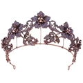 Close-up of vintage baroque tiara featuring purple crystal flowers and bronze metal scrolls - Antique Red Copper with Purple Rhinestones