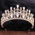 Close-up of golden baroque bridal crown with clear crystals and intricate metalwork - KC Gold White Rhinestone