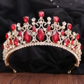Detailed macro view of baroque bridal crown with red crystals and gold metal frame - KC Gold White Diamond + Large Red Diamond