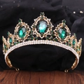 Macro detail of Baroque bridal crown with vintage gold alloy and emerald green crystals - KC Gold White & Olive Green Rhinestone