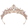 Close-up of golden bridal crown with intricate leaf patterns and sparkling AB crystals - KC Gold White + AB Rhinestone