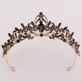 Close-up of golden bridal crown featuring intricate black rhinestones and leaf motifs - Antique Gold Full Black