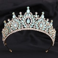 Close-up of gold bridal tiara with light blue teardrop rhinestones on black fabric - Gold Blue & White Rhinestone (KC Gold White & Green Jelly Style)