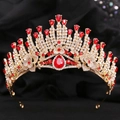 Luxurious gold crystal tiara featuring radiant red pear-shaped gemstones on black background - KC Gold Clear and Red Rhinestone
