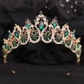 Detailed view of the gold baroque crown featuring emerald green teardrop crystals - KC Gold White Diamond + Green Diamond