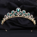 Macro detail of royal gold tiara featuring teardrop green crystals and white rhinestones - KC Gold White Diamond + Green Diamond