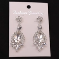 Elegant drop earrings with flower top and teardrop crystal in silver alloy setting - Silver White Earring Post Earrings