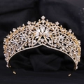 Macro shot of luxury butterfly crystal crown with gold base and drop-shaped center stone - KC Gold White Rhinestone
