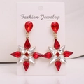 Detailed view of alloy star drop earrings featuring red and white crystals in gold settings - Gold Color (White And Red Rhinestone)