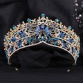Detailed close-up of blue teardrop crystal and rhinestones on a gold baroque crown - KC Gold Clear and Blue Rhinestone