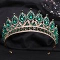Macro shot of vintage gold bridal crown with emerald crystals and white stones - Handmade / Gold Green Zirconia