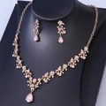 Detailed view of bridal rhinestone jewelry set with pink teardrop pendants and gold plating - Gold Jelly Pink