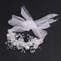 Detailed macro view of bridal flower headband with white pearls and blue petals - Blue Bracelet