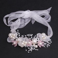 Detail of handcrafted floral headband with white petals, pearls and organza ribbon - Pink Bracelet