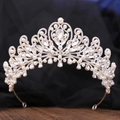 Macro shot of silver bridal tiara showing intricate pearls and sparkling rhinestone patterns - Silver & White Rhinestone