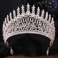 Macro shot of silver Baroque crown with intricate rhinestones and integrated hair comb base - Silver + White (With Comb)