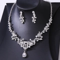 Detailed close-up of bridal rhinestone necklace and earring set on a black display bust - Silver White Rhinestone