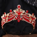 Detail view of wedding crown with red rhinestones and gold floral setting on black silk - KC Gold White Diamond + Large Red Diamond