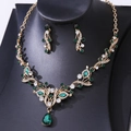 Detail of emerald green teardrop crystals on a gold vine necklace and earring set - Gold Olive Green Rhinestone