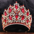 Close-up of golden bridal crown with luxury red crystals and leaf-shaped rhinestones - KC Gold (White and Red Rhinestone)