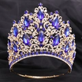 Detail of luxury gold tiara with royal blue crystals and sparkling leaf design - KC Gold (White and Blue Stone + Adjustable Crown)