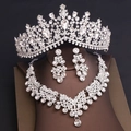 Detailed macro view of luxurious bridal jewelry set with sparkling rhinestones and silver finish - Tiara Necklace Earrings Combination / Silver White Rhinestone
