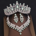 Detailed close-up of luxury bridal jewelry set with green stones and sparkling crystals - Tiara Necklace Earrings Combination / Silver Green Gemstone