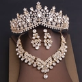Detailed macro view of luxurious gold bridal jewelry set with sparkling rhinestones and crystals - Tiara Necklace Earrings Combination / Gold White Rhinestone
