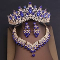 Macro shot of luxury bridal jewelry set with royal blue gems and sparkling white rhinestones - Tiara Necklace Earrings Combination / Gold Blue Gemstone
