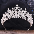 Close-up of silver bridal crown featuring intricate floral patterns and pear-shaped crystals - Thick Silver White Rhinestone