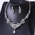 Detailed macro view of luxury silver bridal jewelry set with sparkling rhinestones and crystals - Silver White Rhinestone
