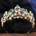 Detail of emerald green crystal crown with golden leaf patterns and sparkling rhinestones - KC Gold White With Olive Green Rhinestone