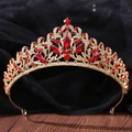 Close-up detail of golden crown with vintage leaf patterns and ruby red gemstones - Gold with Clear and Red Rhinestones