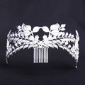 Detailed macro view of silver leaf crown hair comb for bridal wedding accessories - Silver