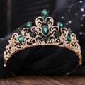 Detail of bridal crown featuring emerald green gems and white rhinestones on gold base - KC Gold White Diamond + Green Diamond