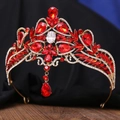 Close-up of golden baroque bridal crown with red gemstones and micro-pave rhinestones - Gold Base Clear & Red Rhinestone