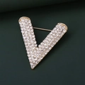 Detailed close-up of a V-shaped golden brooch with shimmering rhinestones and a secure pin - Large / Gold