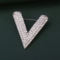 Detailed view of V-shaped brooch with silver plating and sparkling rhinestones - Large / Silver