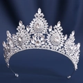 Macro shot of silver bridal tiara featuring teardrop crystals on deep blue velvet base - Thick Silver White Rhinestone