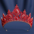 Close-up of golden bridal crown featuring vibrant red crystals and teardrop gems - Gold Base Large Red Crystal