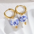 Detail of blue and white porcelain ceramic bead earrings with golden circular hoops - Round Bead (S-E1087)