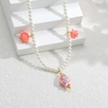 Dettaglio collana di perle con ciondoli a forma di conchiglia, stella e pesce rosa - Stile Conchiglia Stella Marina Rosa (Style 1)