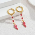 Detailed close-up of pink enamel seahorse drop earrings with gold hoops and beads - Pink Seahorse / Gold