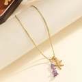 Detail of gold starfish pendant with pearl and purple stones on a snake chain - Starfish Purple Stone Necklace Style (S-N2243-C)