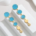 Detail view of long gold drop earrings with turquoise texture and polished discs - Sky Blue Texture Style (YCE1151-lan) / Blue