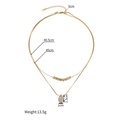 Collana a doppio strato dorata con pendente a goccia di diamante e dettagli lunghezze - Stile a Doppio Strato con Goccia d'Acqua e Strass (S-N2248)