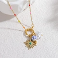 Detail of bohemian gold necklace with colorful beads and celestial sunburst charms - North Star Pendant
