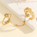 Detail view of gold butterfly chain double ring with bohemian textured coin patterns - Single Zircon and Bohemian Hollow Style (S-R874-A)